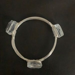 Silver bracelet with clear stones.